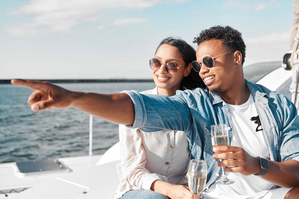 Upscale t-shirt on couple who are on a yacht.